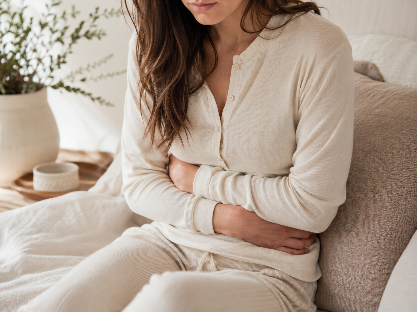 Woman holding stomach
