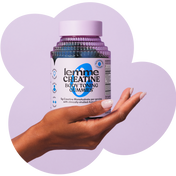 Hand holding a bottle of lemme Creatine Body Toning Gummies against a light purple background