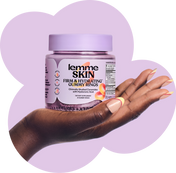 A hand holding a bottle of Lemme Skin Firm & Hydrating Gummy Rings against a stylized lavender cloud-shaped background on a white field.